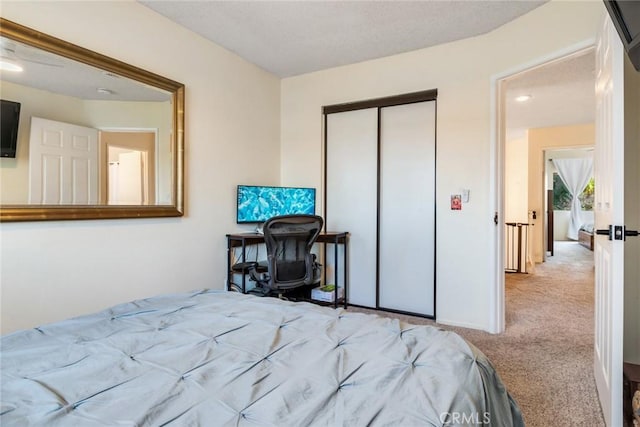 carpeted bedroom with a closet
