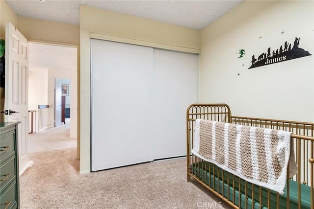 bedroom with a closet and carpet flooring