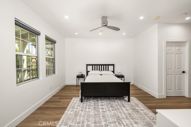bedroom featuring baseboards, a ceiling fan, recessed lighting, and wood finished floors