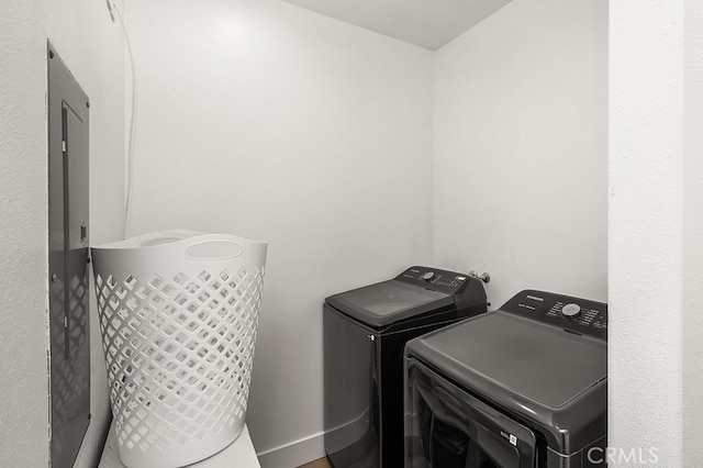 clothes washing area featuring laundry area and washer and dryer