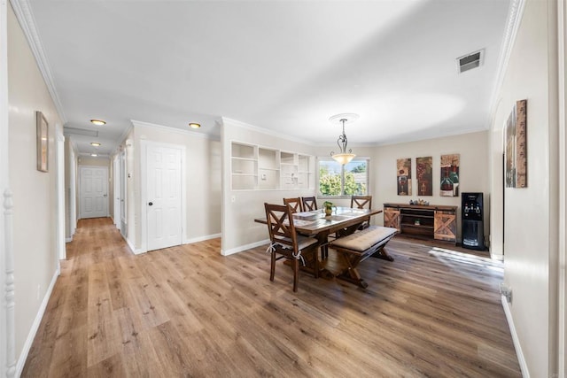 16016 Spangler Peak Rd, Ramona, CA 92065 - dining space with baseboards, ornamental molding, wood finished floors, and visible vents