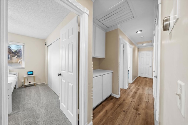 16016 Spangler Peak Rd, Ramona, CA 92065 - hall with baseboards, attic access, crown molding, and wood finished floors