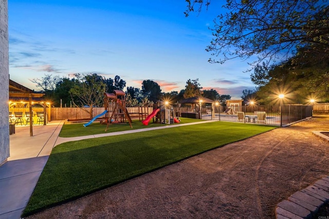16016 Spangler Peak Rd, Ramona, CA 92065 - playground at dusk featuring a gazebo, a yard, fence, and playground community