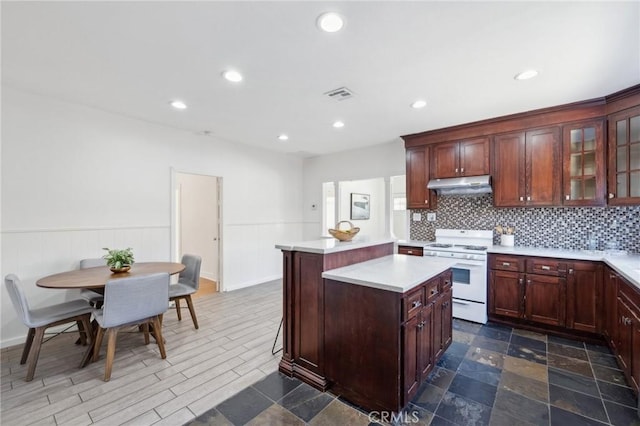 1781 Whitefield Rd, Pasadena, CA 91104 - kitchen featuring a kitchen island, visible vents, white range oven, light countertops, and under cabinet range hood