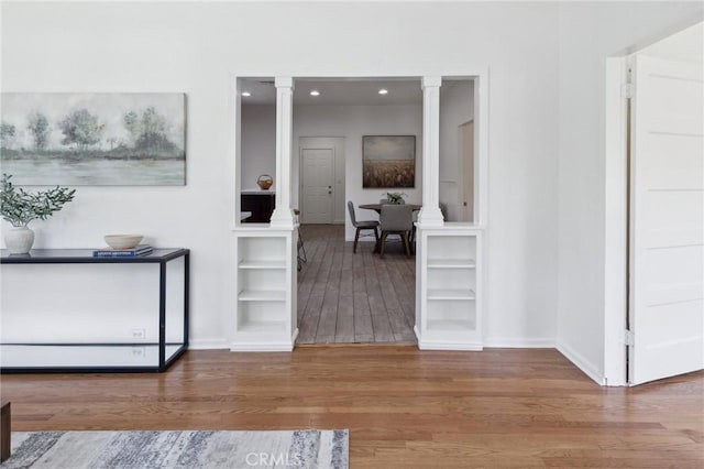 1781 Whitefield Rd, Pasadena, CA 91104 - hallway featuring built in features, wood finished floors, baseboards, ornate columns, and recessed lighting