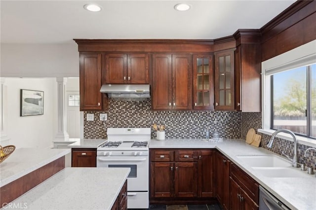 1781 Whitefield Rd, Pasadena, CA 91104 - kitchen featuring a sink, gas range gas stove, backsplash, under cabinet range hood, and glass insert cabinets