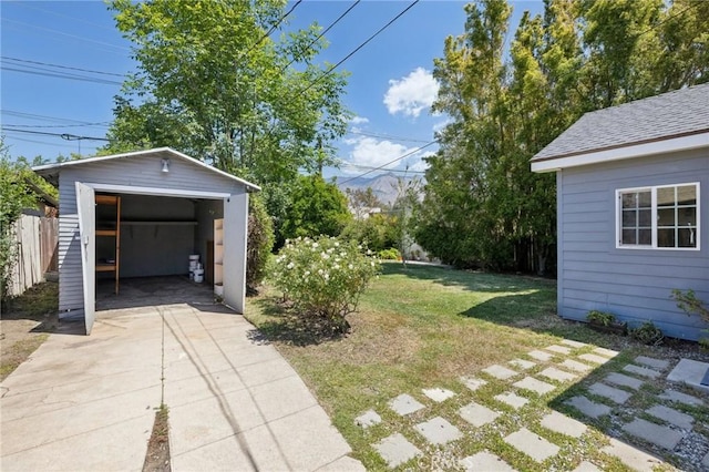 1781 Whitefield Rd, Pasadena, CA 91104 - view of yard featuring a detached garage, fence, and an outdoor structure
