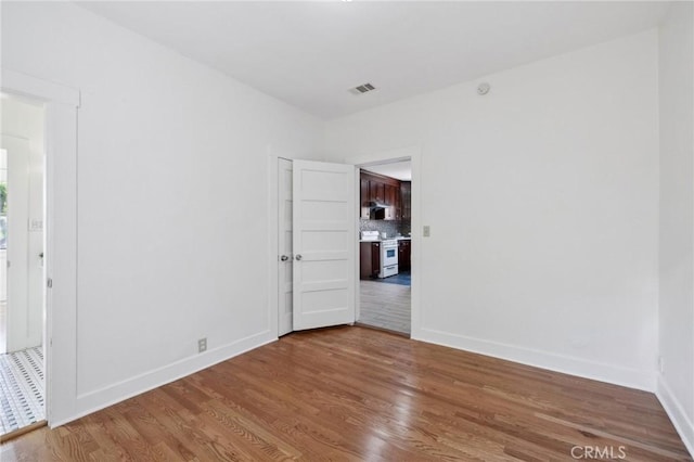 1781 Whitefield Rd, Pasadena, CA 91104 - empty room featuring baseboards, visible vents, and wood finished floors