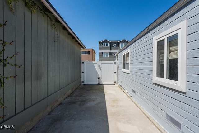 3534 Ocean Dr, Oxnard, CA 93035 - view of home's exterior with fence, a gate, and a patio area