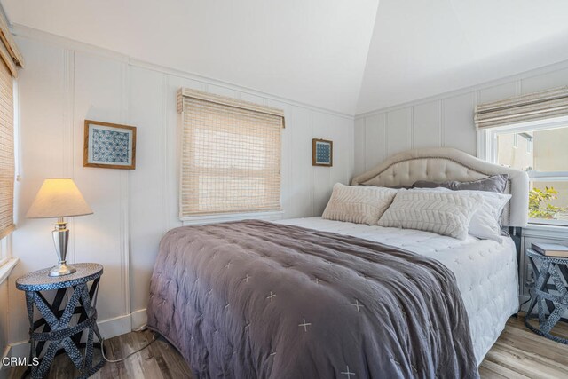 3534 Ocean Dr, Oxnard, CA 93035 - bedroom with wood finished floors and a decorative wall