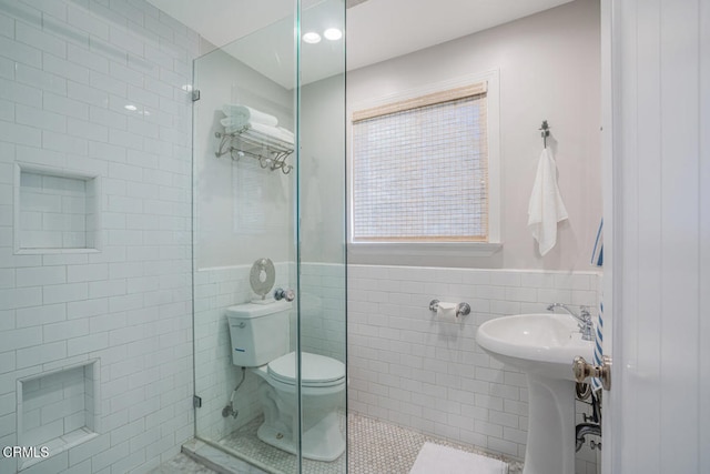 3534 Ocean Dr, Oxnard, CA 93035 - bathroom featuring tile patterned flooring, wainscoting, toilet, and tile walls
