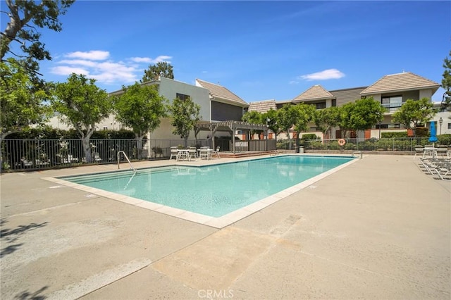 10201 Mason Ave Unit 116, Chatsworth, CA 91311 - pool featuring a pergola, fence, and a patio