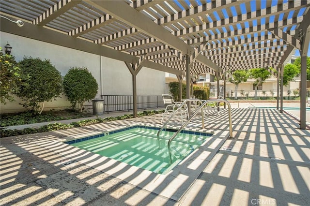 view of pool featuring a pergola and fence