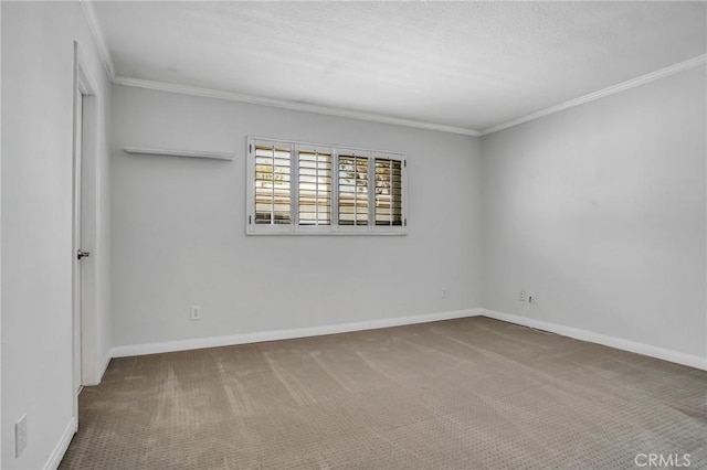 unfurnished room with crown molding, carpet flooring, and baseboards
