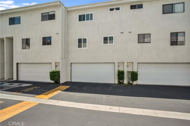 10201 Mason Ave Unit 116, Chatsworth, CA 91311 - exterior space with an attached garage and driveway