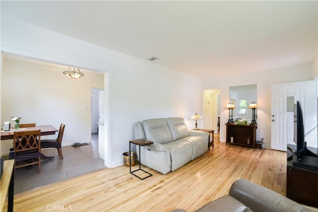 402 Linwood Ave, Monrovia, CA 91016 - living room featuring baseboards, light wood-style flooring, and visible vents