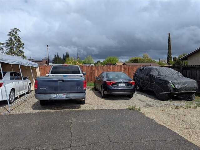 uncovered parking lot with fence
