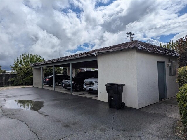 covered parking lot with fence