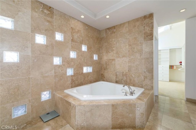 full bathroom featuring a garden tub, recessed lighting, tile patterned flooring, and tile walls