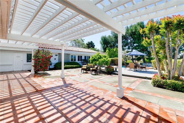 view of patio featuring a pergola and outdoor dining space