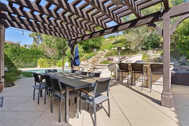 view of patio featuring a pergola and outdoor dining space