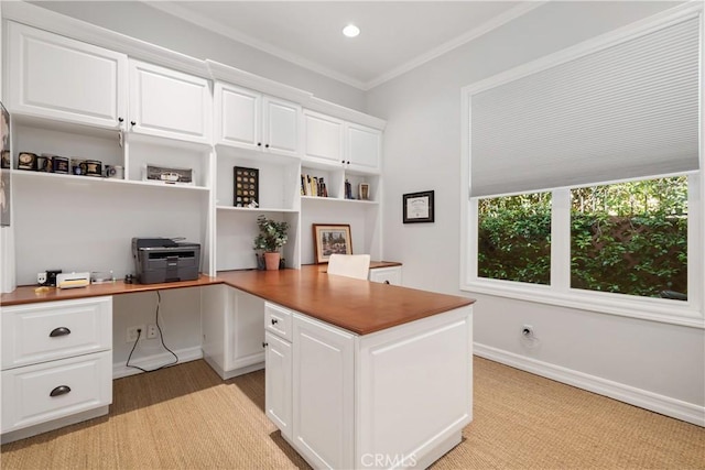 office area featuring baseboards, ornamental molding, built in desk, and recessed lighting