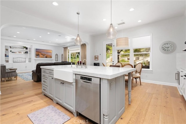 598 N Conejo School Rd, Thousand Oaks, CA 91362 - kitchen with arched walkways, dishwasher, a sink, recessed lighting, and light countertops
