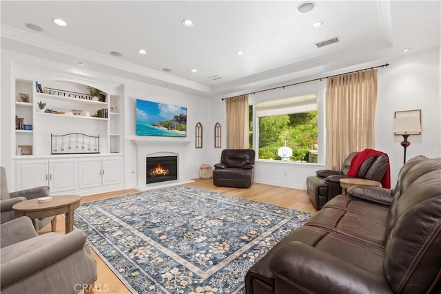 598 N Conejo School Rd, Thousand Oaks, CA 91362 - living room featuring wood finished floors, ornamental molding, a lit fireplace, built in features, and recessed lighting