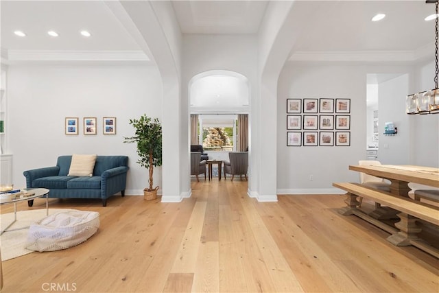 598 N Conejo School Rd, Thousand Oaks, CA 91362 - foyer entrance featuring arched walkways, light wood-style flooring, recessed lighting, baseboards, and crown molding