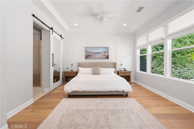 598 N Conejo School Rd, Thousand Oaks, CA 91362 - bedroom with a barn door, light wood-type flooring, baseboards, crown molding, and recessed lighting