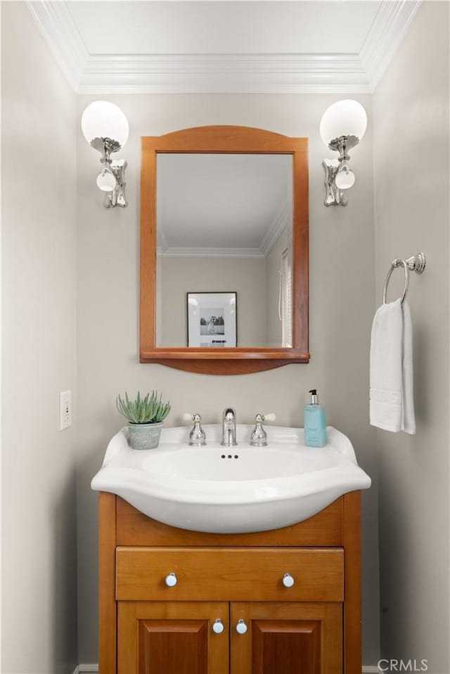bathroom featuring vanity and ornamental molding