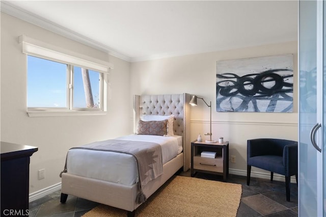 bedroom featuring baseboards and ornamental molding