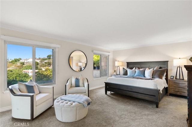 bedroom with baseboards, ornamental molding, and carpet flooring