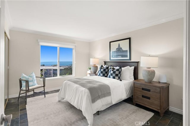 bedroom featuring crown molding, baseboards, a water view, and stone tile flooring
