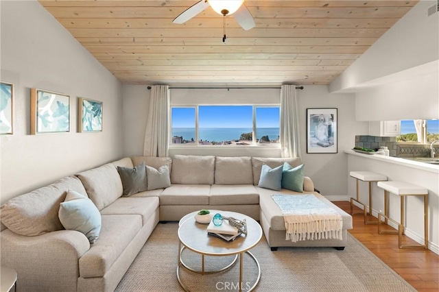 living area featuring ceiling fan, wood finished floors, vaulted ceiling, visible vents, and wood ceiling