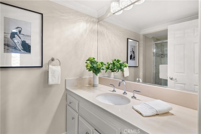 full bathroom featuring crown molding, baseboards, a shower stall, and vanity