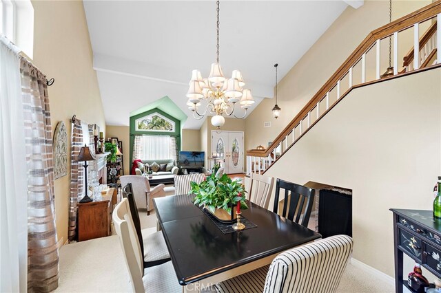 carpeted dining room with an inviting chandelier, stairs, a towering ceiling, and baseboards