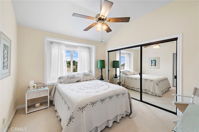 bedroom with multiple windows, vaulted ceiling, and light carpet