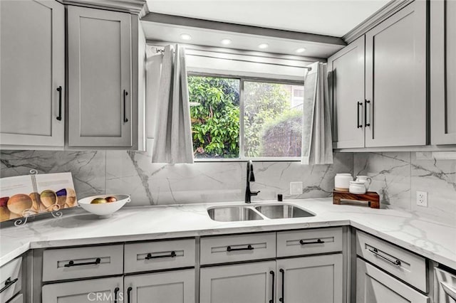 kitchen with a sink and gray cabinetry