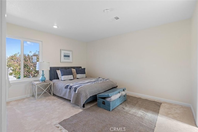 bedroom with carpet floors, baseboards, recessed lighting, and visible vents