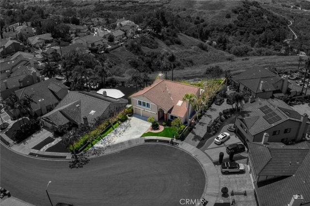 birds eye view of property with a residential view