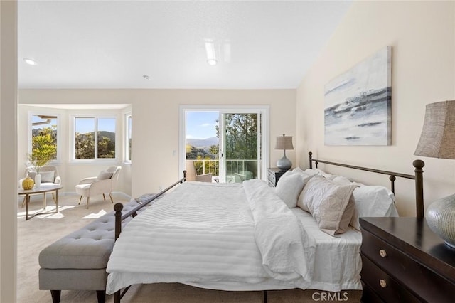 carpeted bedroom featuring access to outside