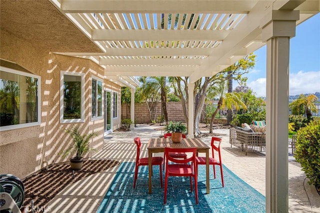 view of patio featuring a fenced backyard, a pergola, and an outdoor living space