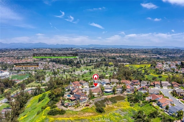 drone / aerial view with a residential view and a mountain view
