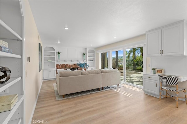 living room featuring recessed lighting and light wood finished floors