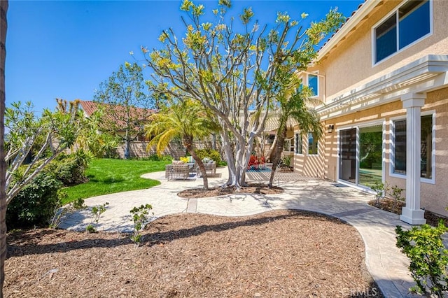 view of yard with fence and a patio area