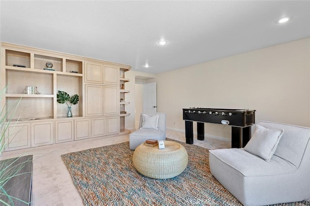 sitting room with carpet and recessed lighting