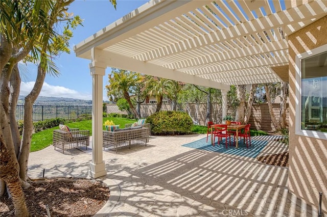 view of patio / terrace with outdoor dining area, a fenced backyard, and a pergola