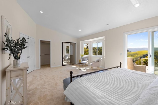 bedroom featuring light colored carpet, multiple closets, lofted ceiling, and multiple windows