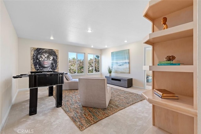 interior space featuring baseboards, recessed lighting, and light colored carpet